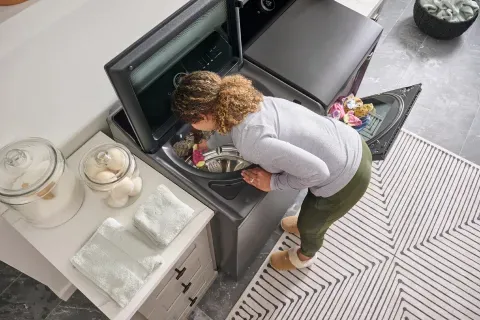 lg-mega-capacity-smart-top-load-washer-WT8600CB-birds-eye-view-woman-doing-laundry